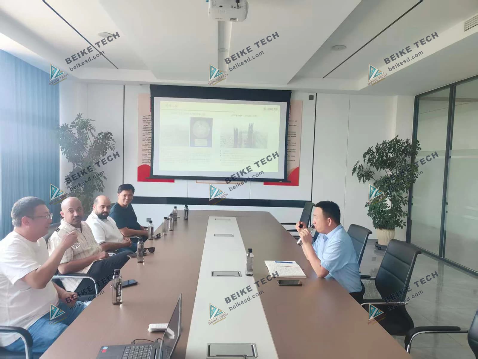 Foreign customers attend project meeting at factory