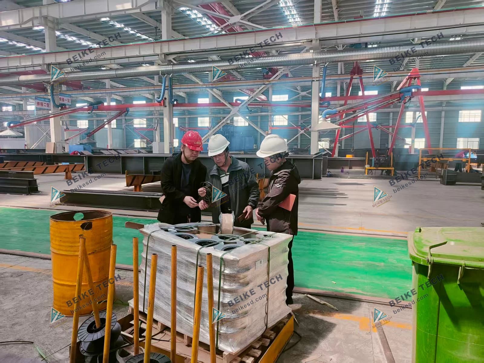 Foreign customers check products in factory workshop