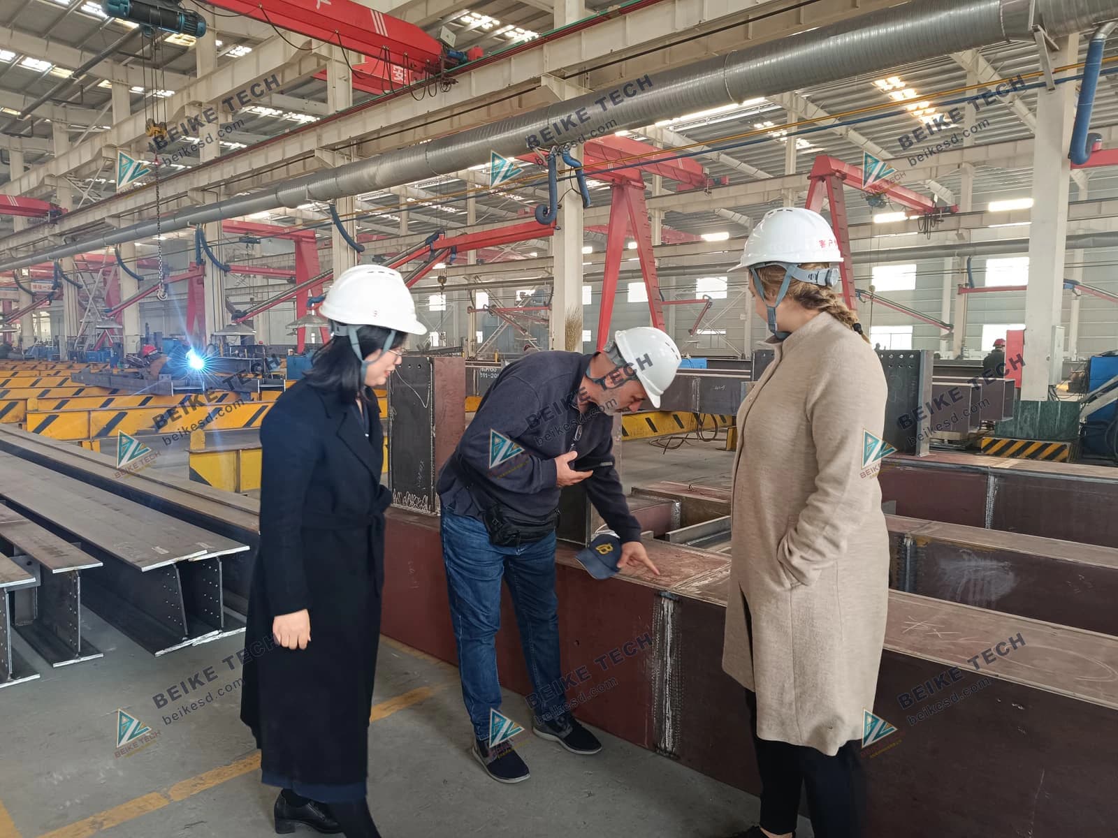 Foreign customers inspect steel structure fabrication details